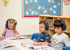Child doing auditory learning at Yuma Preschool