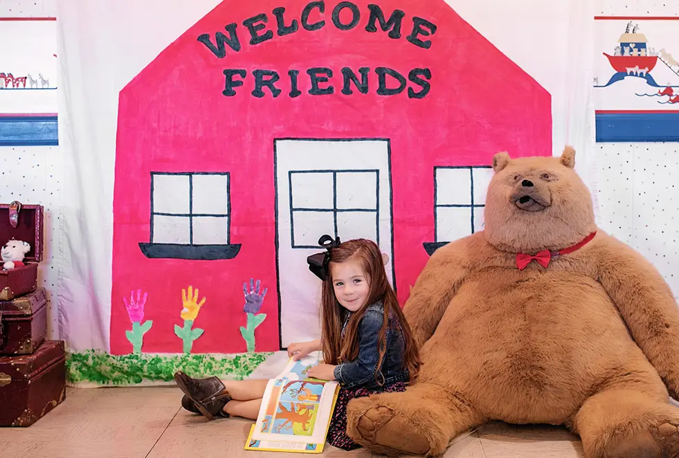 Child reading a book at Yuma Pre-School